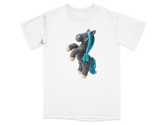 Crocheted gray horse with blue mane and tail on a white t-shirt.