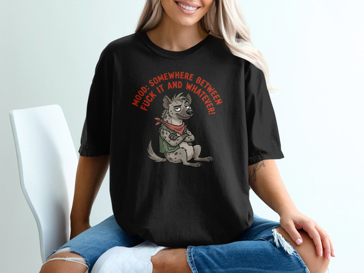 T-shirt with a cartoon hyena wearing a bandana and a "Mood: Somewhere between fuck it and whatever!" graphic.