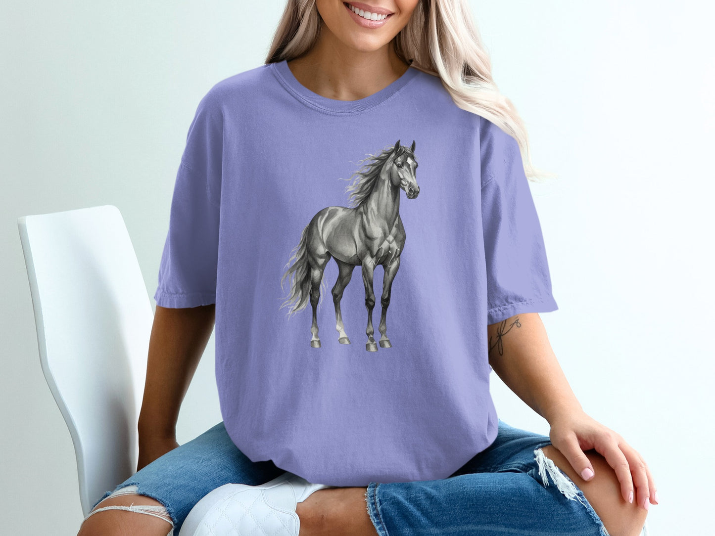 Purple t-shirt featuring a detailed sketch of a galloping horse.