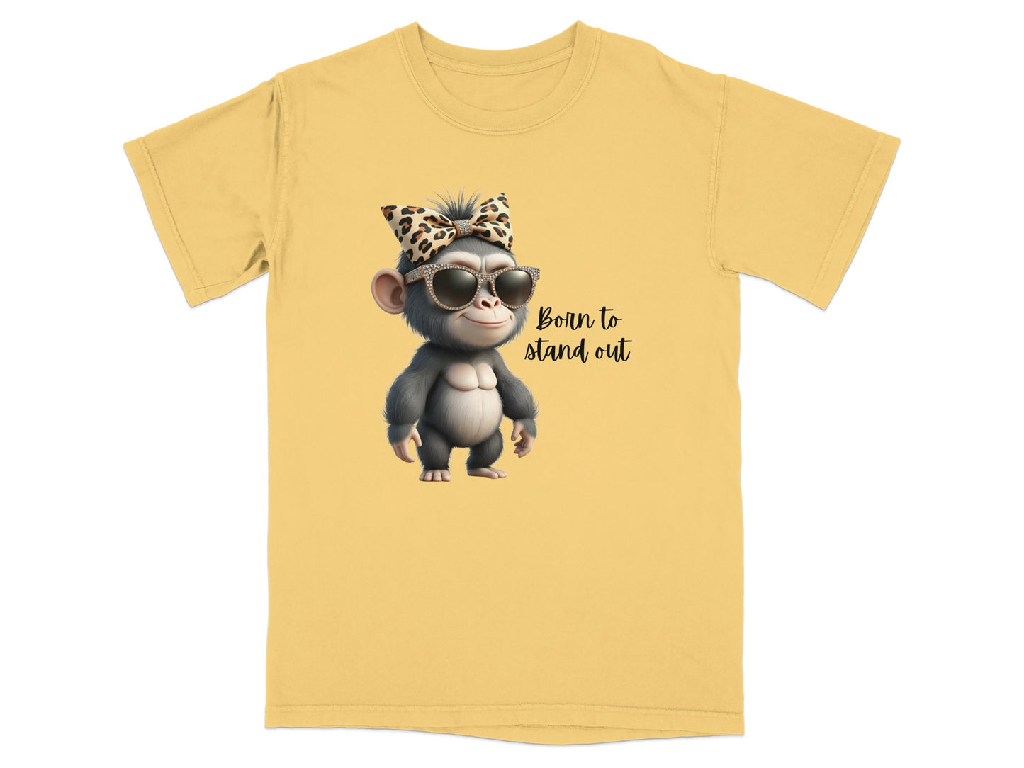 Yellow t-shirt with cartoon monkey wearing sunglasses and leopard bow, text "Born to stand out".