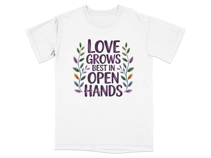 White t-shirt with "Love Grows Best in Open Hands" text and floral accents.