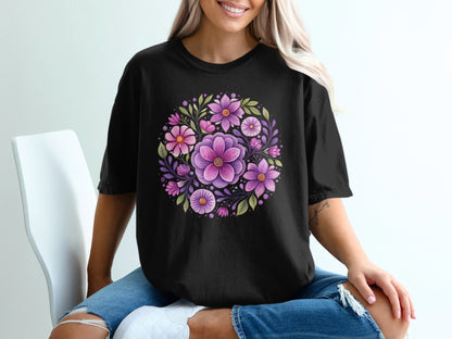 Black t-shirt with a circular floral design of purple and pink flowers.