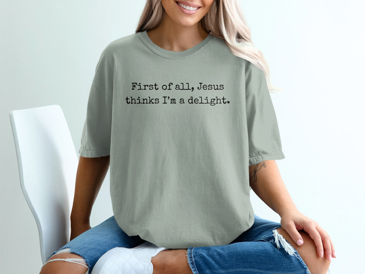 T-shirt with "First of all, Jesus thinks I'm a delight" text.