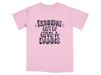 Pink t-shirt with "RUNNING OUT OF GIVE-A-DAMS" text.