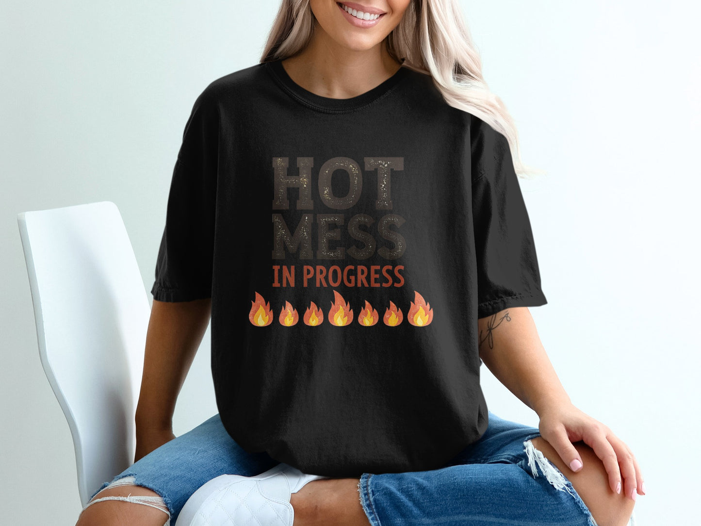 Black t-shirt with "HOT MESS IN PROGRESS" and flame graphic.