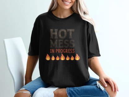 Black t-shirt with "HOT MESS IN PROGRESS" and flame graphic.