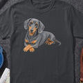 Dark gray t-shirt with realistic black and tan dachshund illustration.