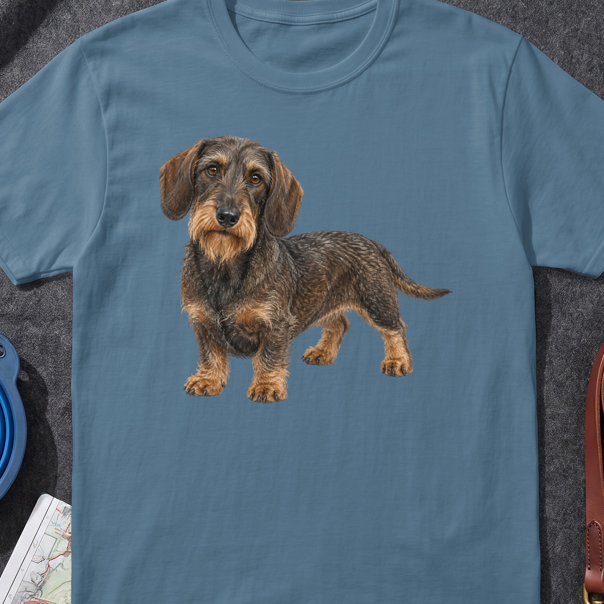 Blue t-shirt with a textured wirehaired dachshund illustration across the chest.
