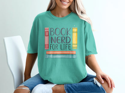 Green t-shirt with "BOOK NERD FOR LIFE" and stacked books graphic.