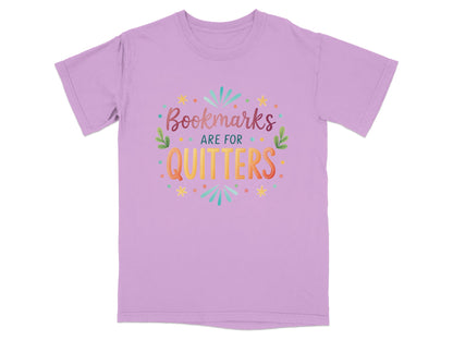 Purple t-shirt with "Bookmarks are for quitters" text and colorful accents.