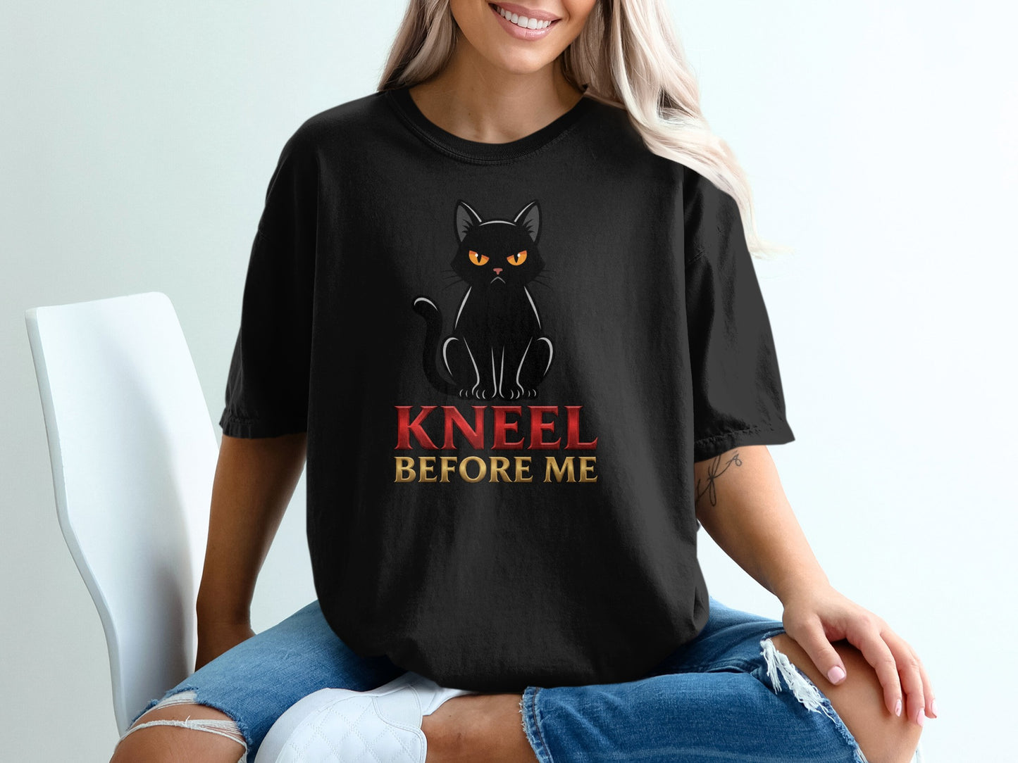 Black t-shirt with angry black cat and "KNEEL BEFORE ME" text.