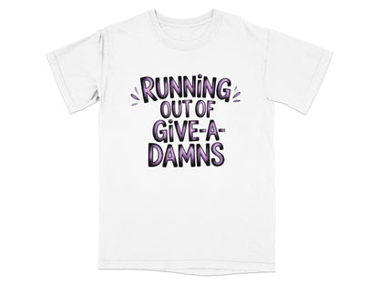 White t-shirt with "RUNNING OUT OF GIVE-A-DAMNS" text in purple and pink.