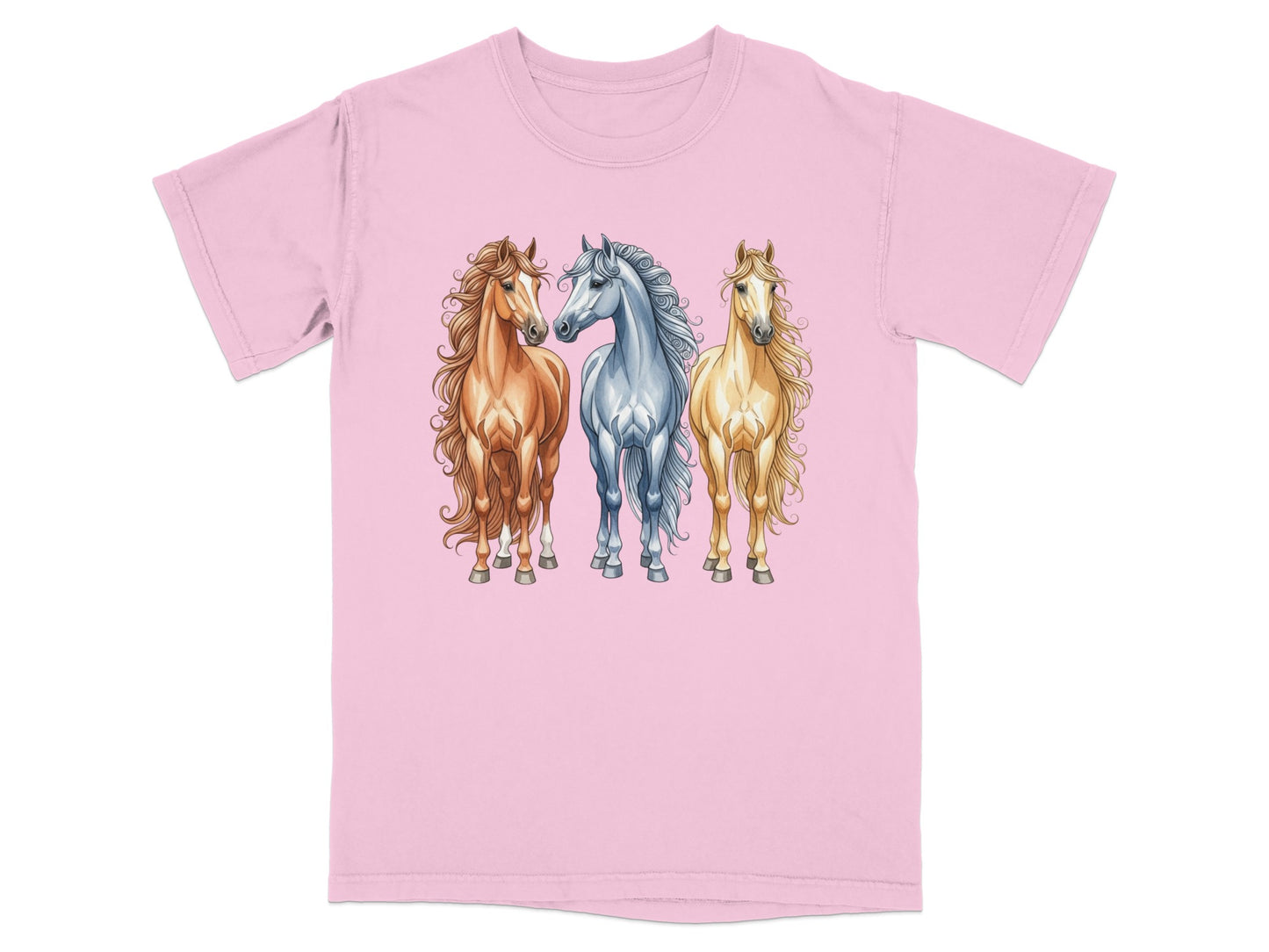 Three horses, two brown and one white, with flowing manes, on a pink t-shirt.