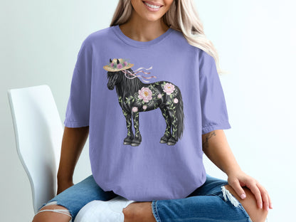 Purple t-shirt with black horse adorned with flowers and a straw hat.