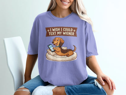 Dachshund dog wearing a collar rests on a cushion, text reads "I wish I could text my wiener".
