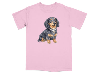 Pink t-shirt with watercolor illustration of a black and tan dachshund.
