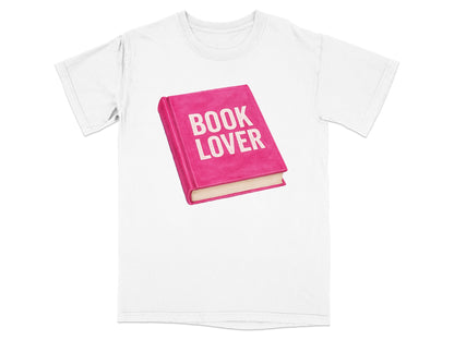 Pink book with "BOOK LOVER" in white text on a white t-shirt.