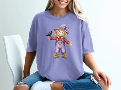 Purple t-shirt with a scarecrow and black crow graphic.