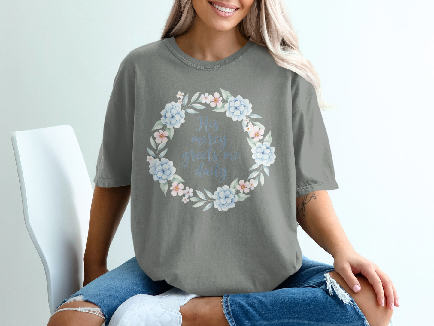 Gray t-shirt with floral wreath and text "His mercy greets me daily".