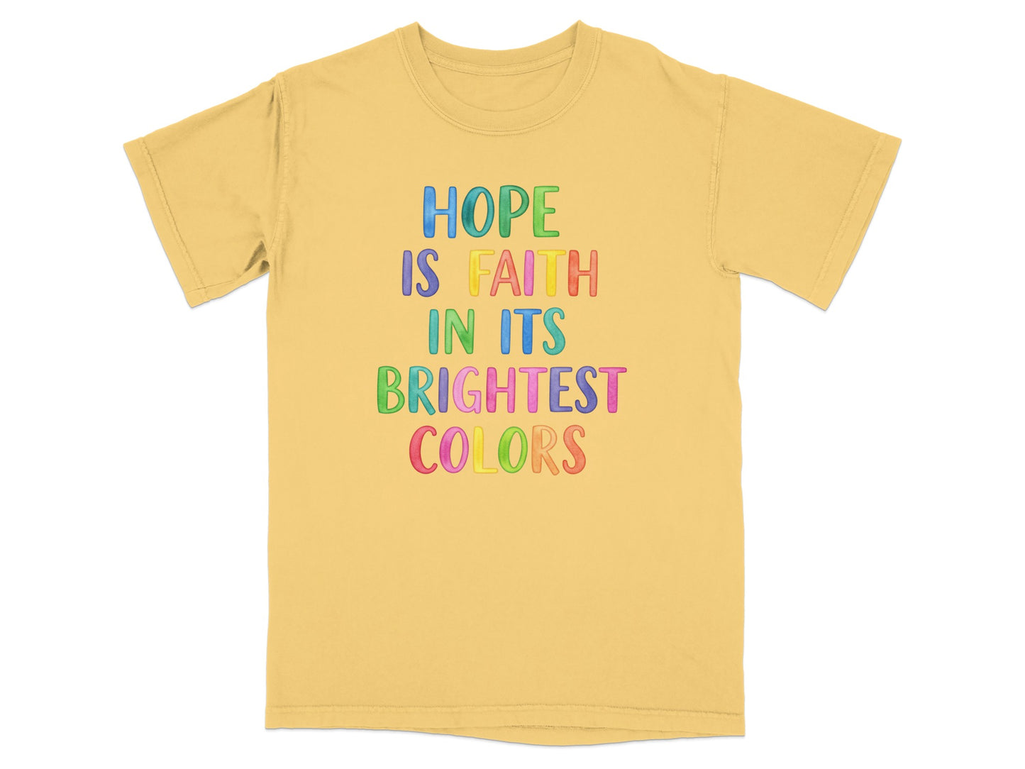 Yellow t-shirt with colorful text reading "HOPE IS FAITH IN ITS BRIGHTEST COLORS".