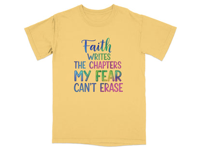 Yellow t-shirt with colorful text: "Faith writes the chapters my fear can't erase."