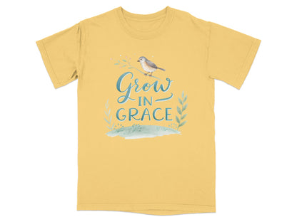 Yellow t-shirt with "Grow in Grace" text and bird on a branch.