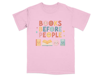 Pink t-shirt with "Books Before People" text and kawaii book and button graphics.