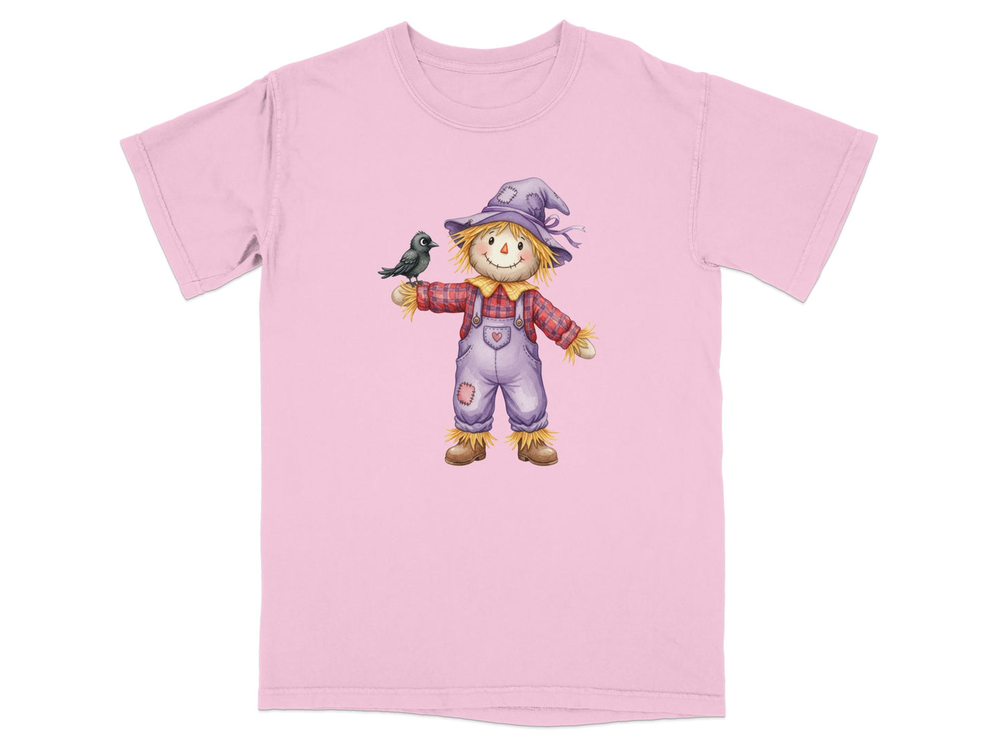 Pink t-shirt with a cartoon scarecrow wearing a hat and overalls, holding a bird.