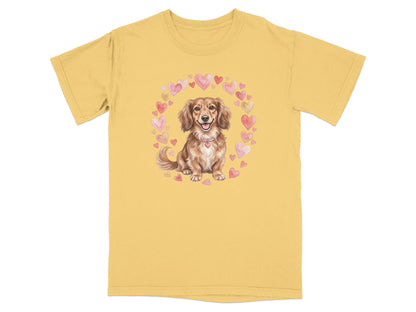 Dachshund with watercolor hearts framed on a yellow t-shirt.