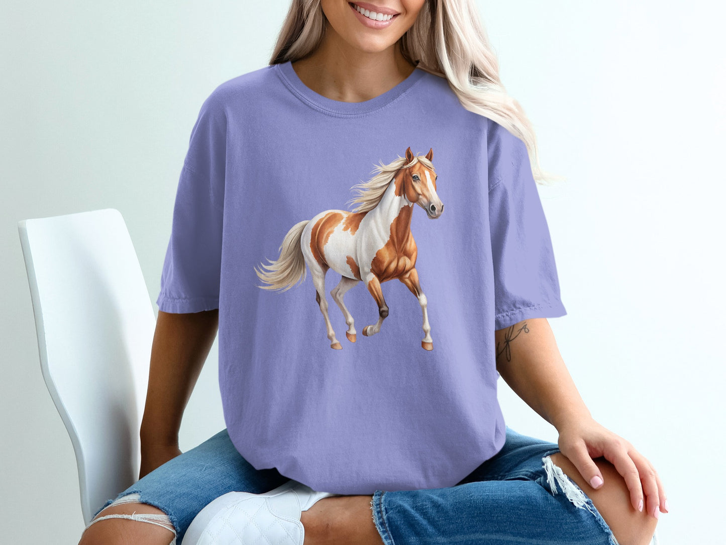 Purple t-shirt with a painted horse graphic.