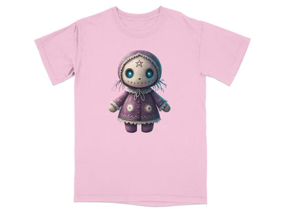 Pink t-shirt with a cartoon doll graphic featuring large starry eyes and intricate stitching.