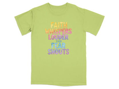 Green t-shirt with "FAITH WHISPERS LOUDER THAN FEAR SHOUTS" text.