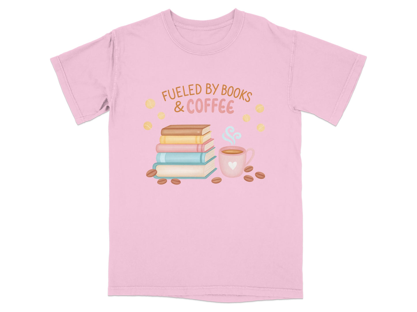 Pink t-shirt with "Fueled by Books & Coffee" text and book and coffee cup illustration.