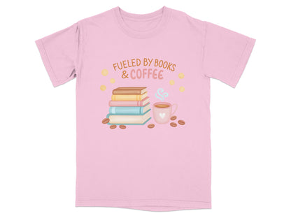 Pink t-shirt with "Fueled by Books & Coffee" text and book and coffee cup illustration.