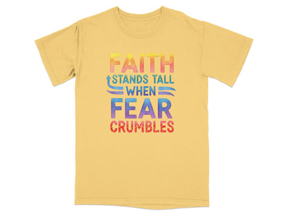 Yellow t-shirt with rainbow text "FAITH STANDS TALL WHEN FEAR CRUMBLES".