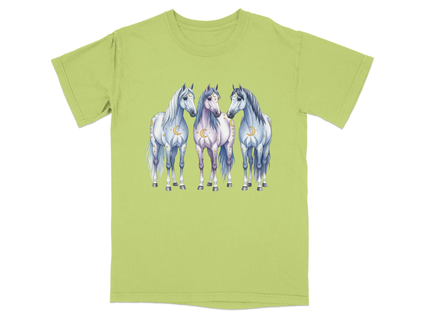 Three stylized horses with moon and star accents stand together on a light green t-shirt.