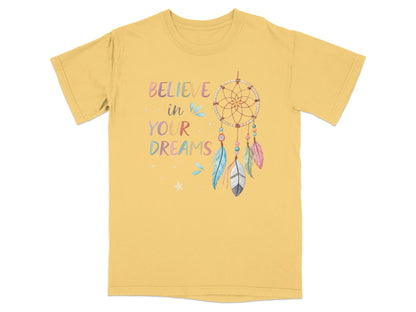 Yellow t-shirt with dreamcatcher and "Believe in your dreams" text.