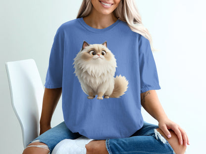 Blue t-shirt featuring a fluffy cartoon cat with large eyes.