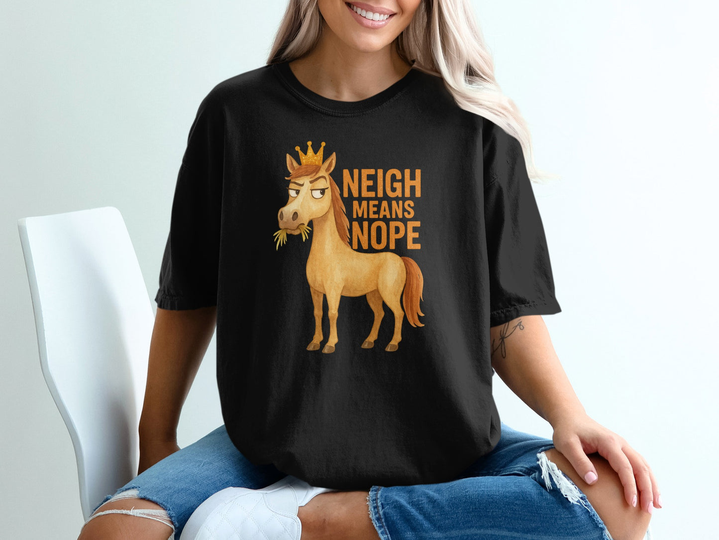 Black t-shirt with crowned horse graphic and "NEIGH MEANS NOPE" text.