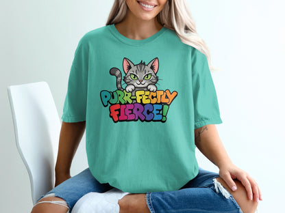 Teal t-shirt with "Purr-fectly Fierce!" text and a cartoon cat graphic.
