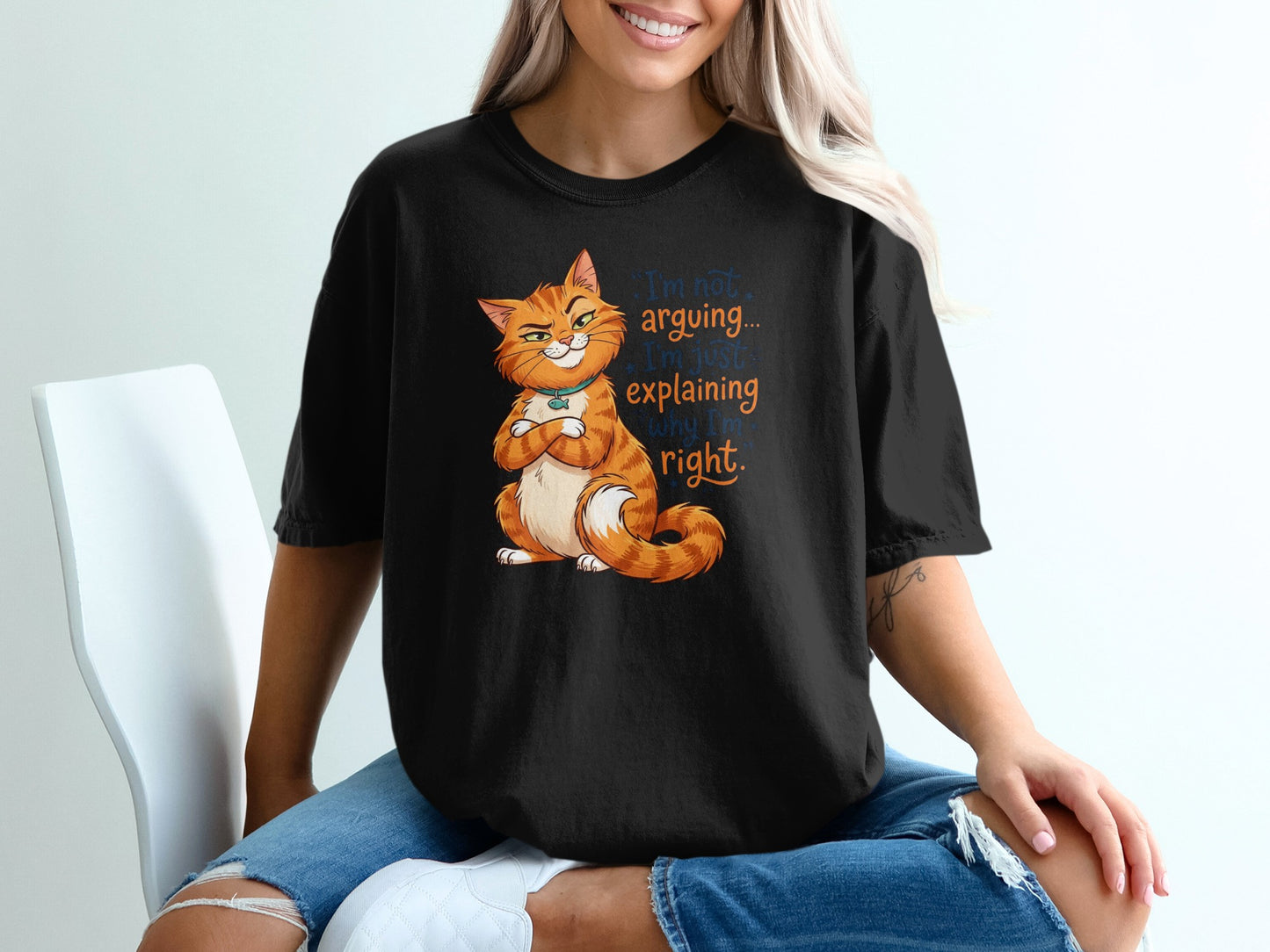 Black t-shirt with orange cat saying "I'm not arguing, I'm just explaining why I'm right."