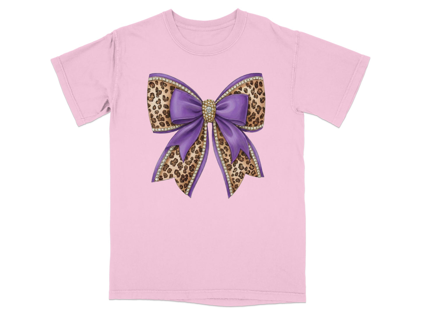 Purple glitter bow with leopard print accents on pink t-shirt.