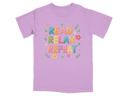 Purple t-shirt with "READ RELAX REPEAT" text and floral accents.
