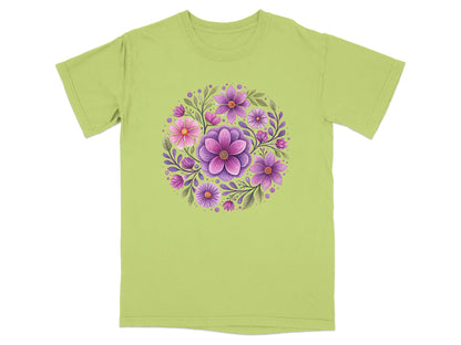 Green t-shirt with a circular floral design of pink and purple flowers.