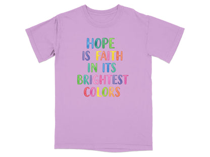 Light purple t-shirt with "HOPE IS FAITH IN ITS BRIGHTEST COLORS" in colorful text.