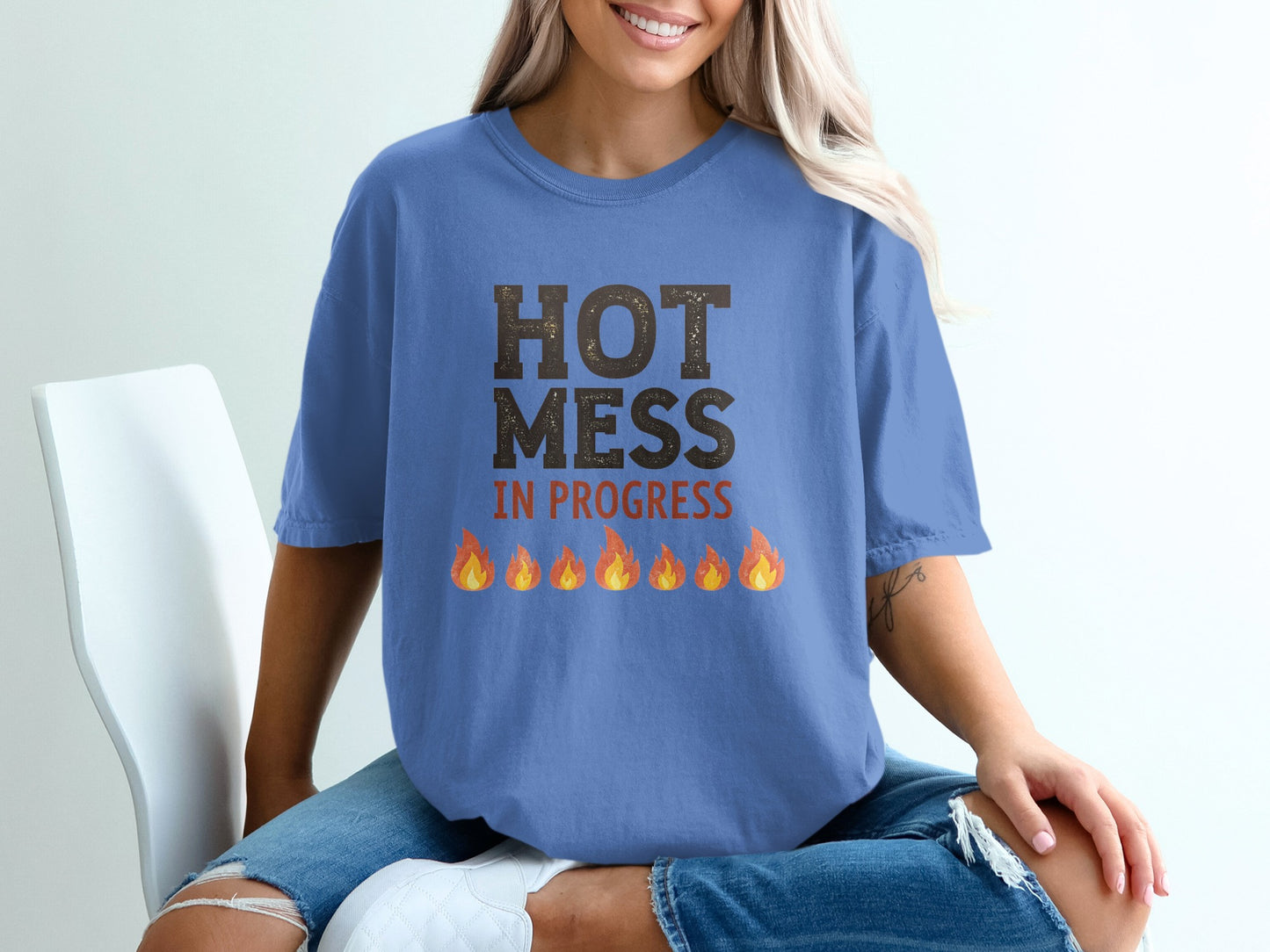Blue t-shirt with "HOT MESS IN PROGRESS" and flaming embers graphic.