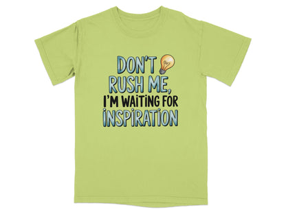 Light green t-shirt with text "Don't rush me, I'm waiting for inspiration."