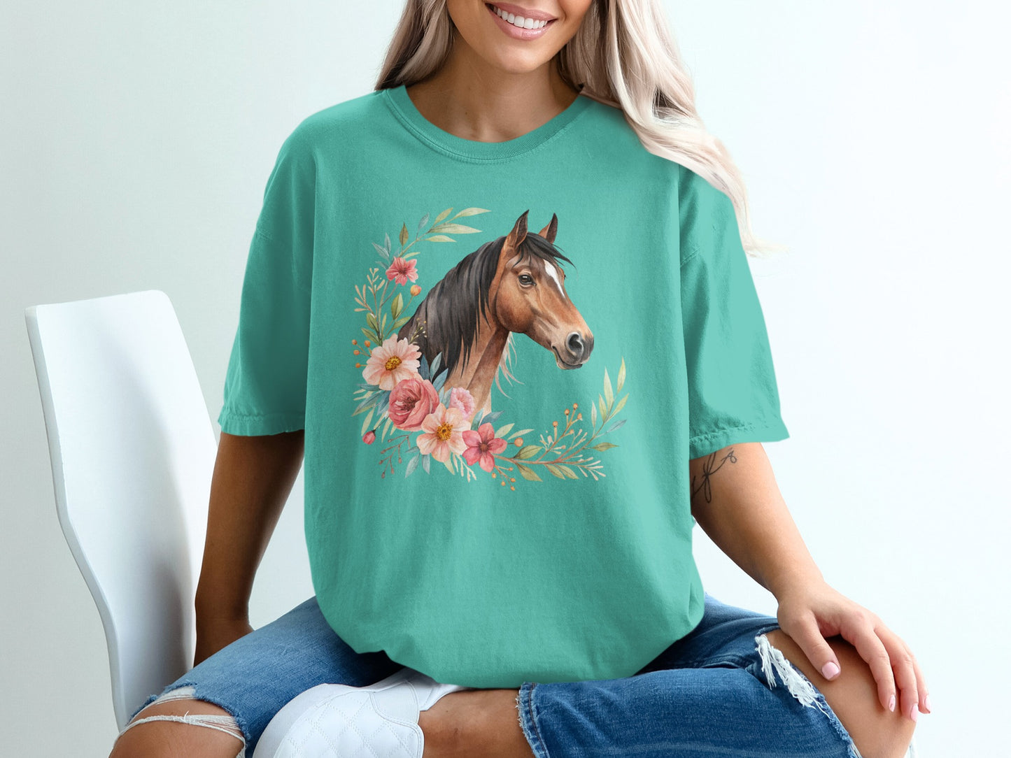 Teal t-shirt with floral horse portrait design.