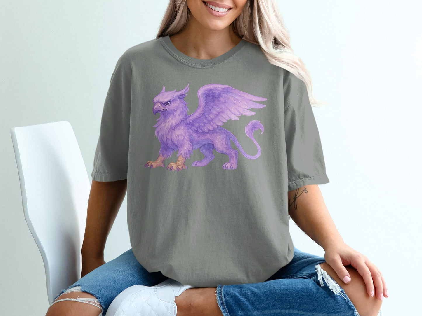 Grey t-shirt with a purple watercolor griffin illustration on the front.