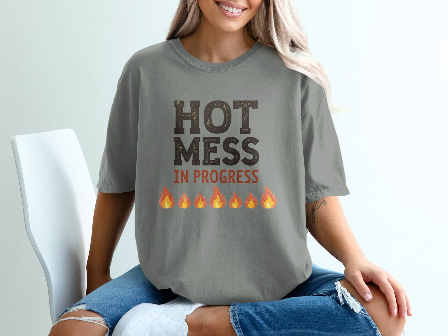 Gray t-shirt with "HOT MESS IN PROGRESS" and colorful flames graphic.